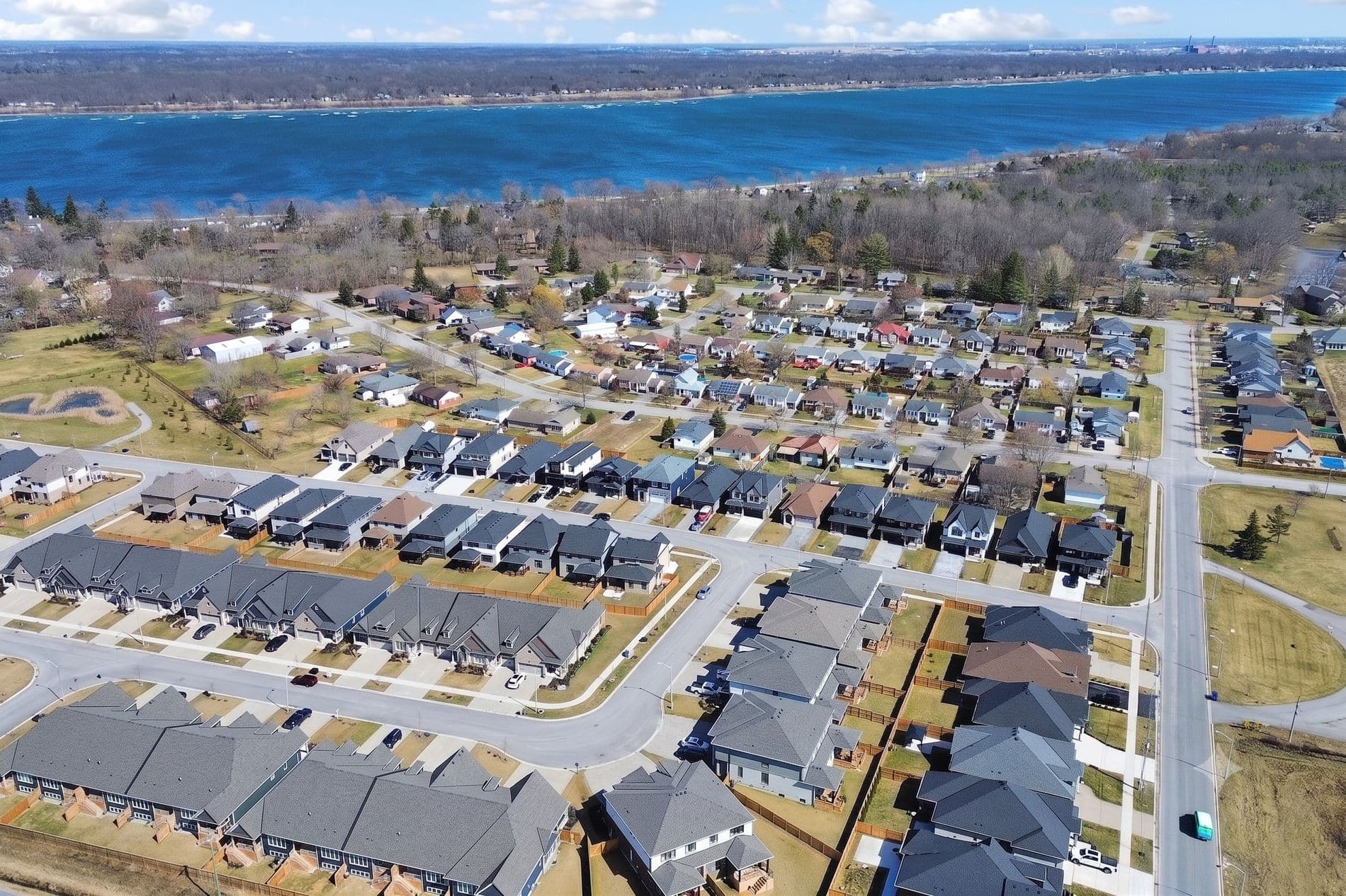 Aerial view over the Black Creek community looking north across the Niagara River, showing the new detached homes and townhomes with open land beyond