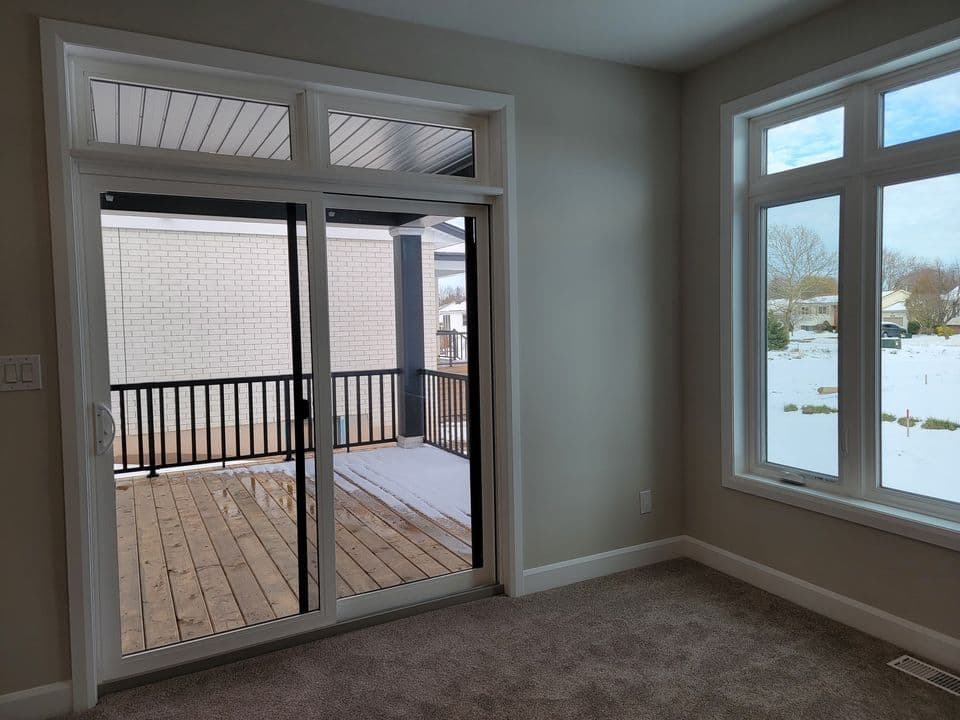 Dining area with sliding doors opening onto the covered rear deck